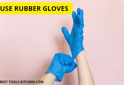 A person wearing blue rubber gloves for better grip and open a tight bottle cap