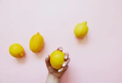A man holding lemons 